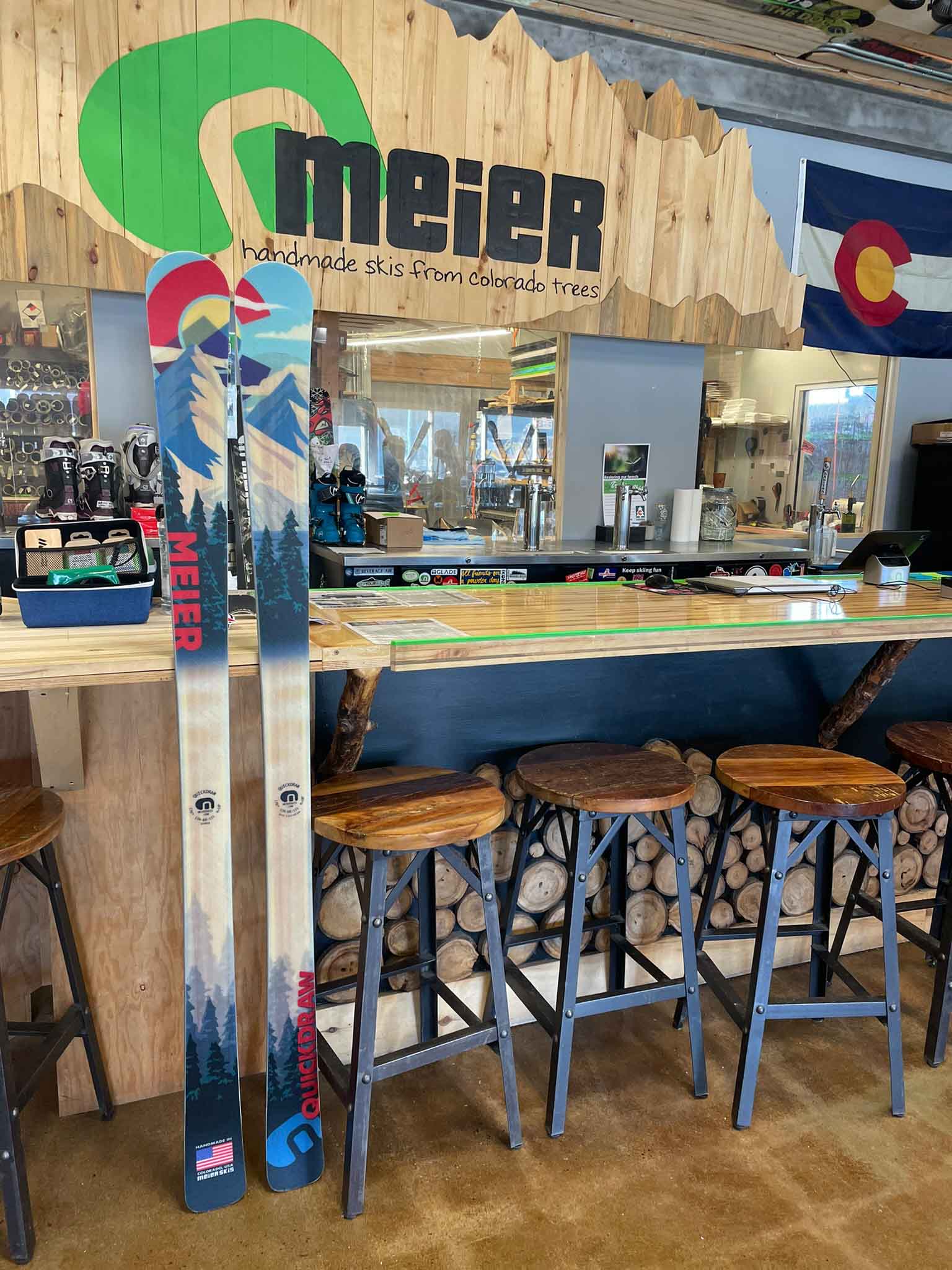 Quickdraw all-mountain ski leaning on Meier bar